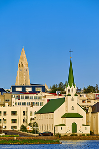 Lutheran free church by lake Tjornin and Halgrimskirkja
