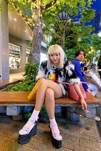 Punk girl enjoying evening in America Mura district Osaka Japan