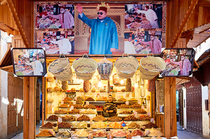 Dried fruit stall in the Medina of Fez Morocco with local vendo