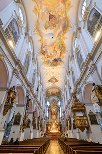 Exploring St. Peters Church in Munich Bavaria amid morning lig by Marco Brivio
