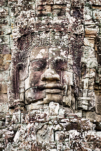 Ancient Khmer stone face Bayon temple.
