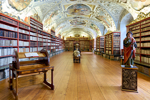Vast ornate library with countless books painted ceiling and 