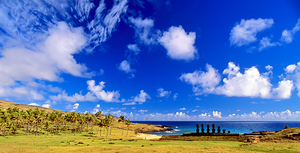 Moai statues palm trees and beach on Easter Island.