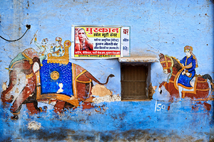 A painted house in Bundi displays vibrant art of elephants and r