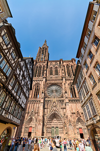 Tourists gather at Strasbourg Cathedral in Alsace on a sunny day