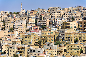 Cityscape of Amman Jordan with numerous buildings and structures
