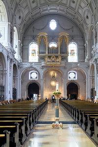 St. Michael Church interior view and wooden pews in Munich