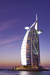 Burj Al Arab hotel illuminated at dusk in Dubai UAE