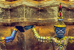Wat Phra Kaew statues supporting the temple structure in Bangkok