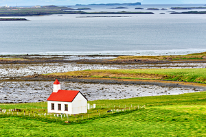 Church stands in western fjords of Iceland near the sea