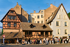 Historic houses and people walking in Petit France Strasbourg