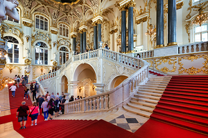 Visitors explore Jordan Staircase Winter Palace St. Petersburg