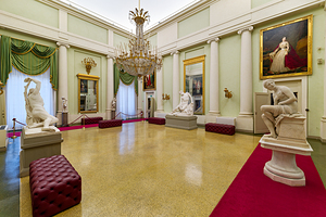 Visitors explore Palatine Gallery in Palazzo Pitti in Florence