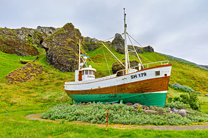 Fishing boat near Olafsvik in Iceland on a cloudy day