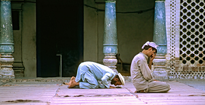 Men pray in the mosque in Chitral during afternoon prayer by Marco Brivio