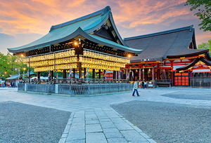 Yasaka shrine temple in Kyoto during sunset with lanterns and vi