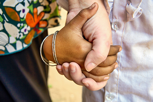 Diverse hands holding showing connection and support.