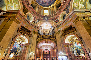 Stunning Baroque church interior with intricate frescoes and gra