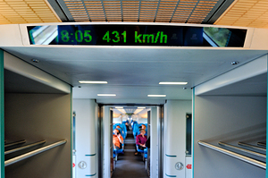 High speed train interior showing speed readout in Shanghai