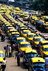 Taxi parking in Kolkatas busy streets during daytime