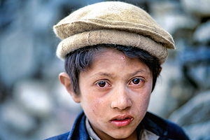 Young boy at Shandur Pass in Pakistan during daytime
