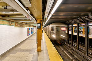 Subway train arrives at 34th Street station in Manhattan New Yo