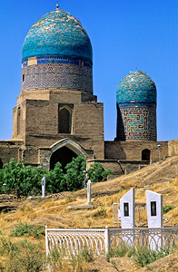 Cemetery in Samarkand with blue domes and historical buildings