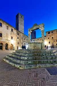 Sunset view of Piazza della Cisterna in San Gimignano Tuscany
