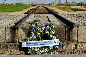 Wreath placed at railroad tracks in Auschwitz concentration camp