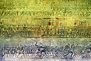 Ancient bas reliefs depicting processions deities and battles.