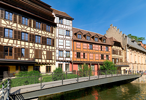 Visitors enjoy Petit France in Strasbourg with timber framed hou
