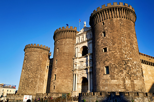 Castel Nuovo stands strong in Naples under clear blue sky