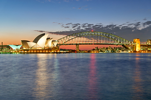 Sydney Opera House and Harbour Bridge at dusk.