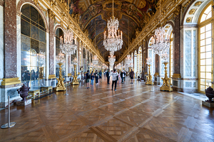 Visitors walk through the Hall of Mirrors at Palace of Versaille