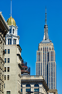 Empire State Building stands tall in Manhattan under clear blue 