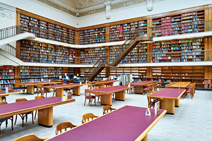 Grand library in Sydney with tall bookshelves and study areas
