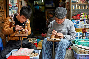 Crafting wooden items in Hanoi workshops during late morning by Marco Brivio