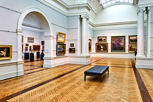 Art gallery interior with paintings and visitors in Sydney