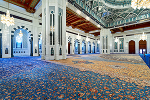 Visitors explore Sultan Qaboos Grand Mosque in Muscat Oman