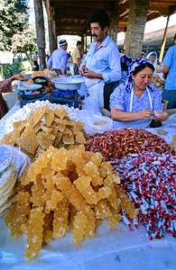 Cooks prepare sweets at a market in Samarkand Uzbekistan