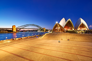 Sydney Opera House and Harbour Bridge at dusk.