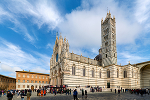 Visitors explore the Cathedral of Siena in Tuscany Italy by Marco Brivio