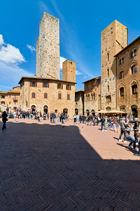 Visitors explore San Gimignano in Tuscany during the day