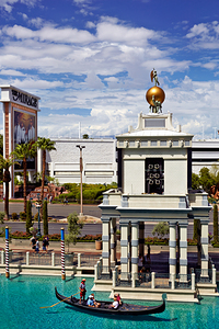 Gondolas travel in water at Venetian Hotel in Las Vegas by Marco Brivio