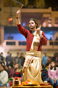 Hindu aarti ceremony at Ganges river in Varanasi during evening