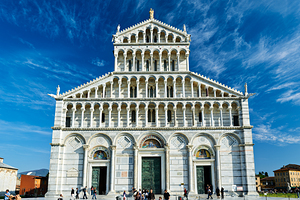 Pisa Cathedral in Piazza dei Miracoli with visitors exploring
