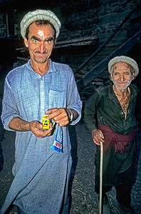 Men show toy in Kalash Village during evening hours