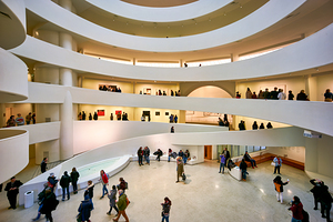 Many people walk through the wide spaces of the Solomon R