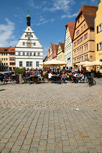 People enjoy meals in Rothenburg ob der Tauber on the Romantic R