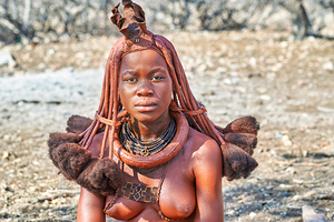 Himba woman wearing traditional hair headdress in Namibia